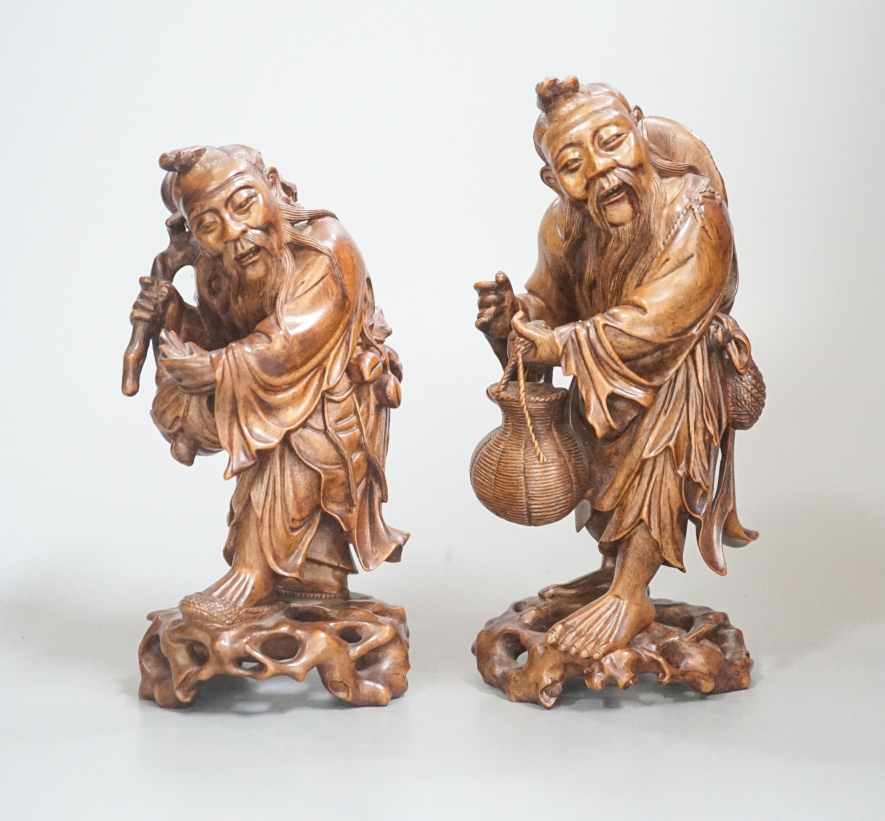 Two Chinese hardwood figures of a fisherman and a old man holding peaches 16cm